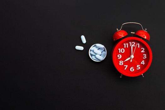 Rad alarm clock with "PrEP" ( Pre-Exposure Prophylaxis). used to prevent HIV on dark background.