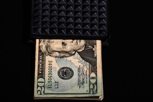 50 Dollars banknotes in a black wallet isolated.