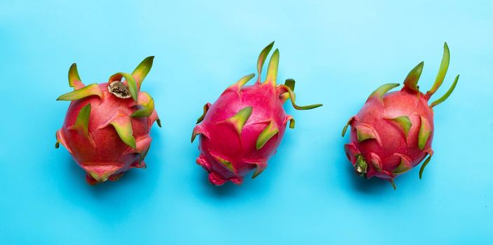 Dragon fruit or pitaya on blue background. Delicious tropical exotic fruit. Top view