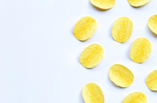 Potato chips on white background. Top view