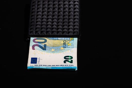 20 Euro money banknotes in black wallet isolated