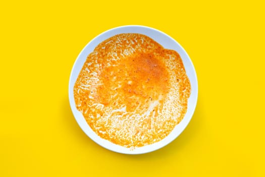 Dirty dish on yellow background. Top view