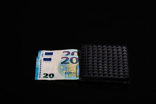 20 Euro money banknotes in black wallet isolated