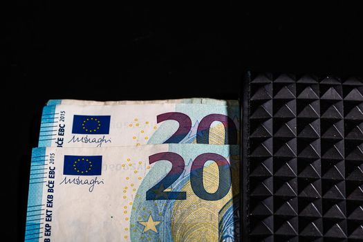 20 Euro money banknotes in black wallet isolated