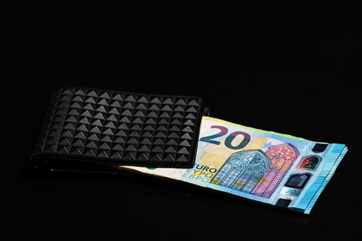 20 Euro money banknotes in black wallet isolated