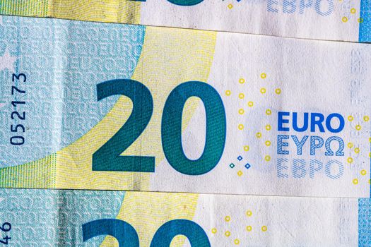 Selective focus on detail of euro banknotes. Close up macro detail of money banknotes, 20 euro isolated. World money concept, inflation and economy concept