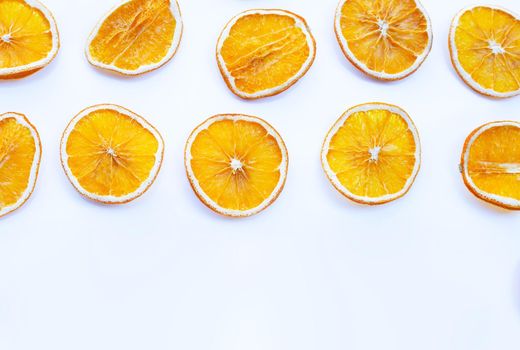 Dried orange slices on white background.