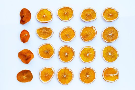 Dried orange slices on white background.