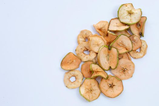 Dried apple slices on white background