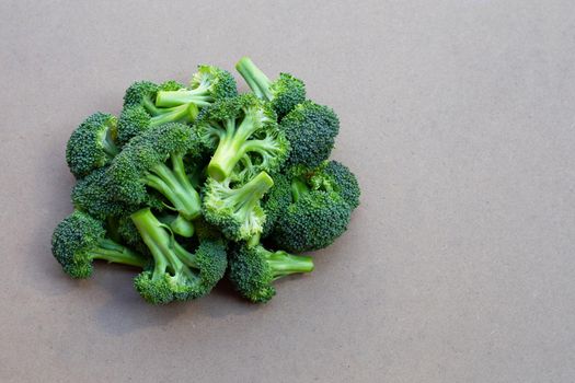 Fresh green broccoli on wooden texure background.