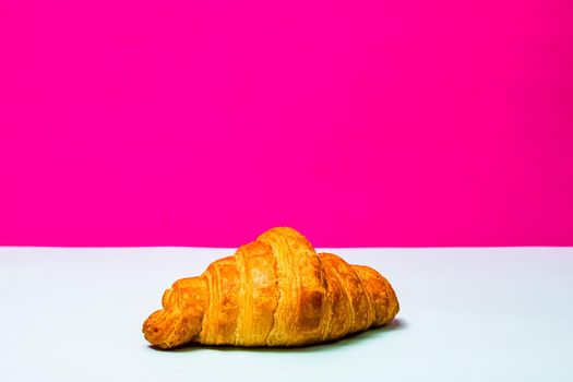 Detail of fresh croissant isolated, french breakfast concept.