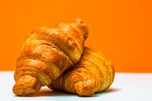 Fresh and delicious croissants isolated. French breakfast concept.