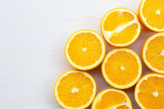 Sliced oranges on table background. High vitamin C, Juicy and sweet.
