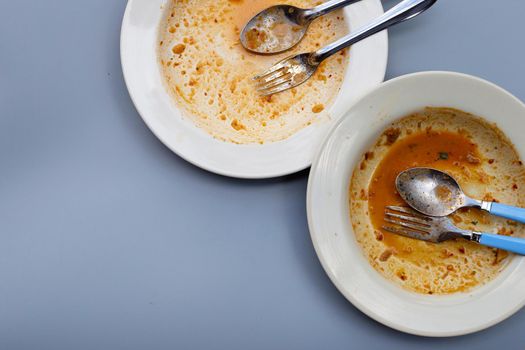 Dirty dishes on grey background. Top view