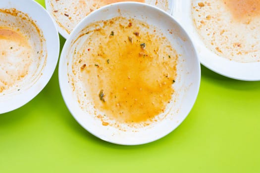 Dirty dishes on green background. Top view