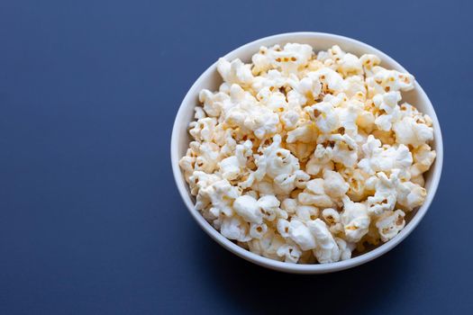 Popcorn on dark background. Copy space