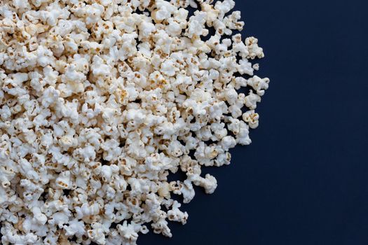 Popcorn on dark background. Copy space