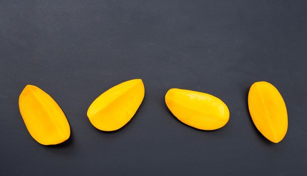Tropical fruit, Mango  on dark background.