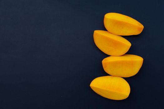 Tropical fruit, Mango on dark background.