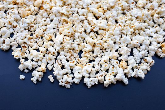 Popcorn on dark background. Copy space
