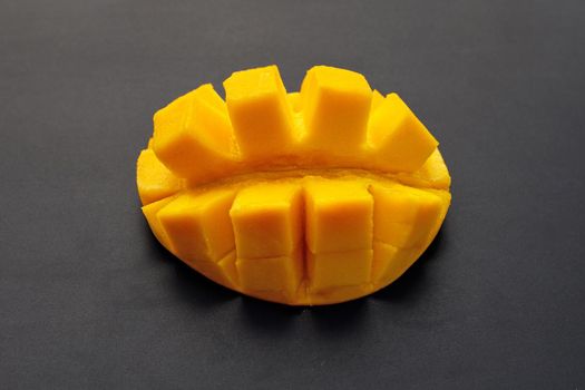 Tropical fruit, Mango on dark background.