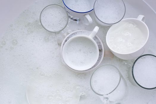 Washing an used drinking glasses and cups