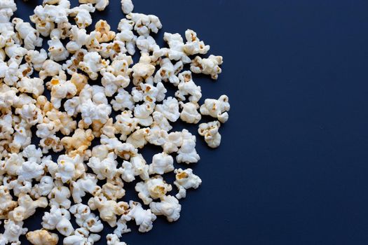 Popcorn on dark background. Copy space