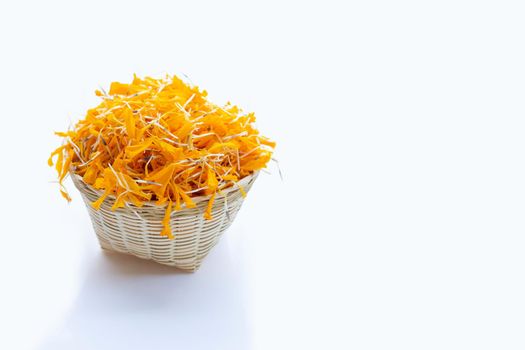 Petals of marigold flower on white background.