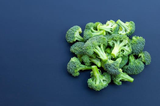 Fresh green broccoli on dark background.
