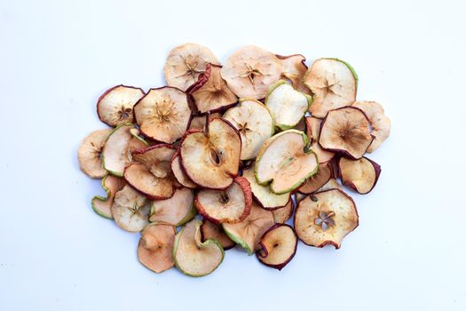 Dried apple slices on white background