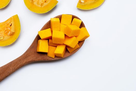 Cut and slices butternut squash on white background.