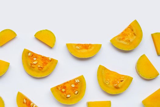 Cut and slices butternut squash on white background.