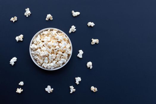 Popcorn on dark background. Copy space