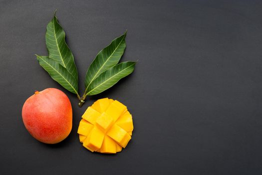 Tropical fruit, Mango  on dark background.