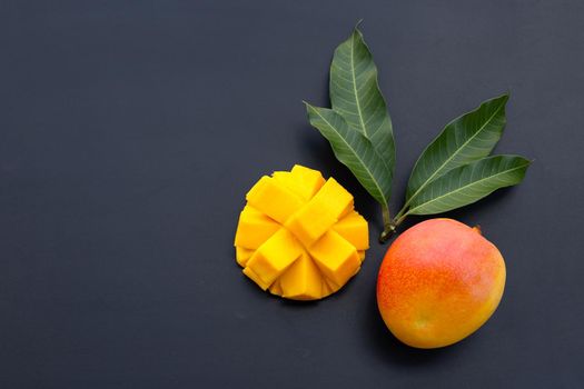 Tropical fruit, Mango  on dark background.