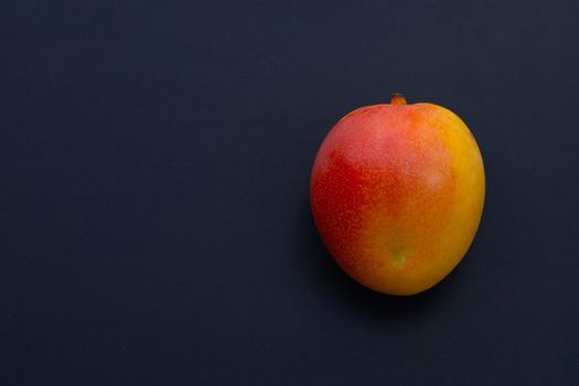 Tropical fruit, Mango  on dark background.