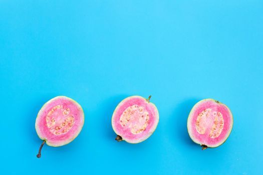 Pink guava on blue background.