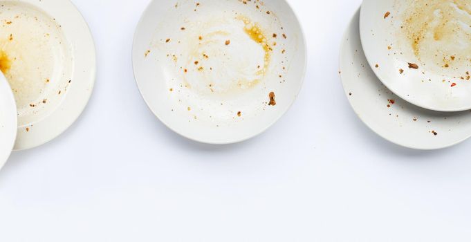 Dirty dishes on white background.