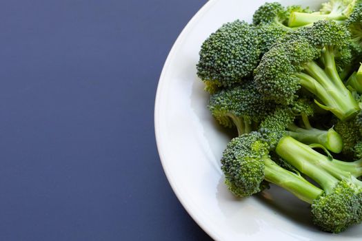 Fresh green broccoli on dark background.