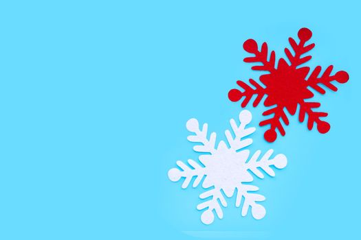 Christmas snowflake on blue background.