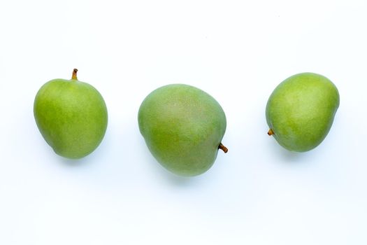 Green mango on white background.