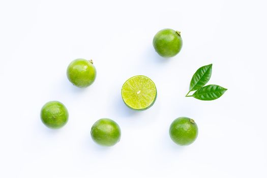 Limes with leaves isolated on white background.