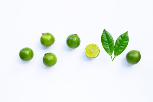 Limes with leaves isolated on white background.