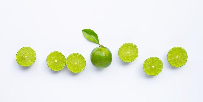 Limes with leaves isolated on white background.