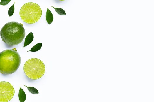 Limes with leaves isolated on white background.