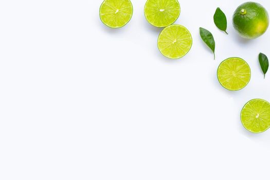 Limes with leaves isolated on white background.