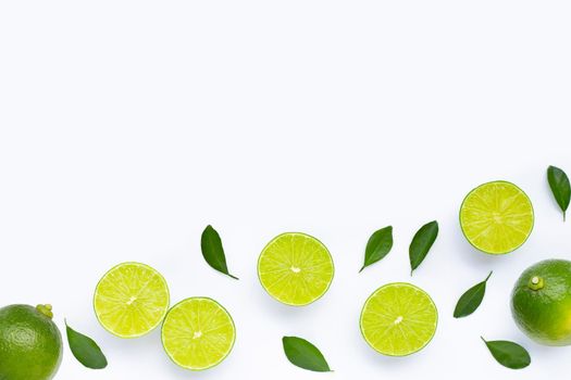 Limes with leaves isolated on white background.