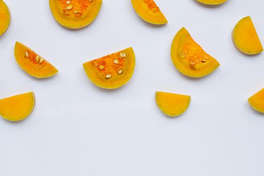 Cut and slices butternut squash on white background.