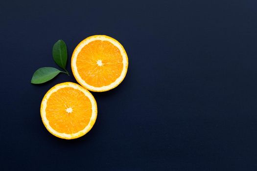 High vitamin C, Juicy and sweet. Fresh orange fruit on dark background.