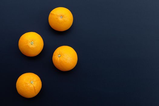 High vitamin C, Juicy and sweet. Fresh orange fruit on dark background.